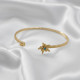 Gold Renk Ayarlanabilir Dövme Kelepçeli Doğum Ayı Çiçeği Bilezik (Aralık) Gold Renk Ayarlanabilir Dövme Kelepçeli Doğum Ayı Çiçeği Bilezik (Aralık)